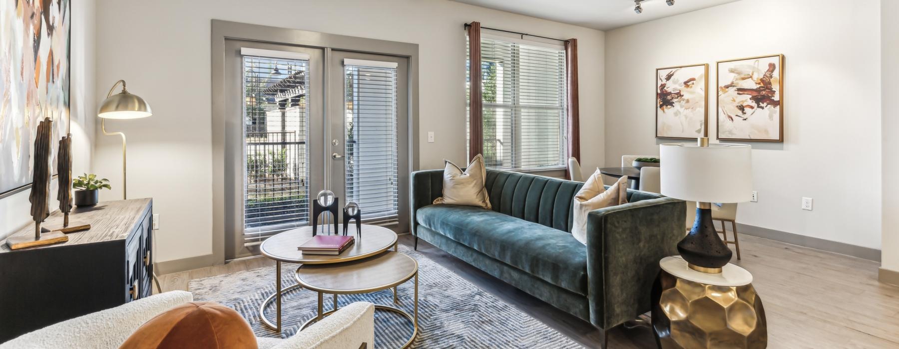 a living room with a couch and a fan