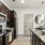 a kitchen with black cabinets