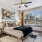 a bedroom with a bed and a fan